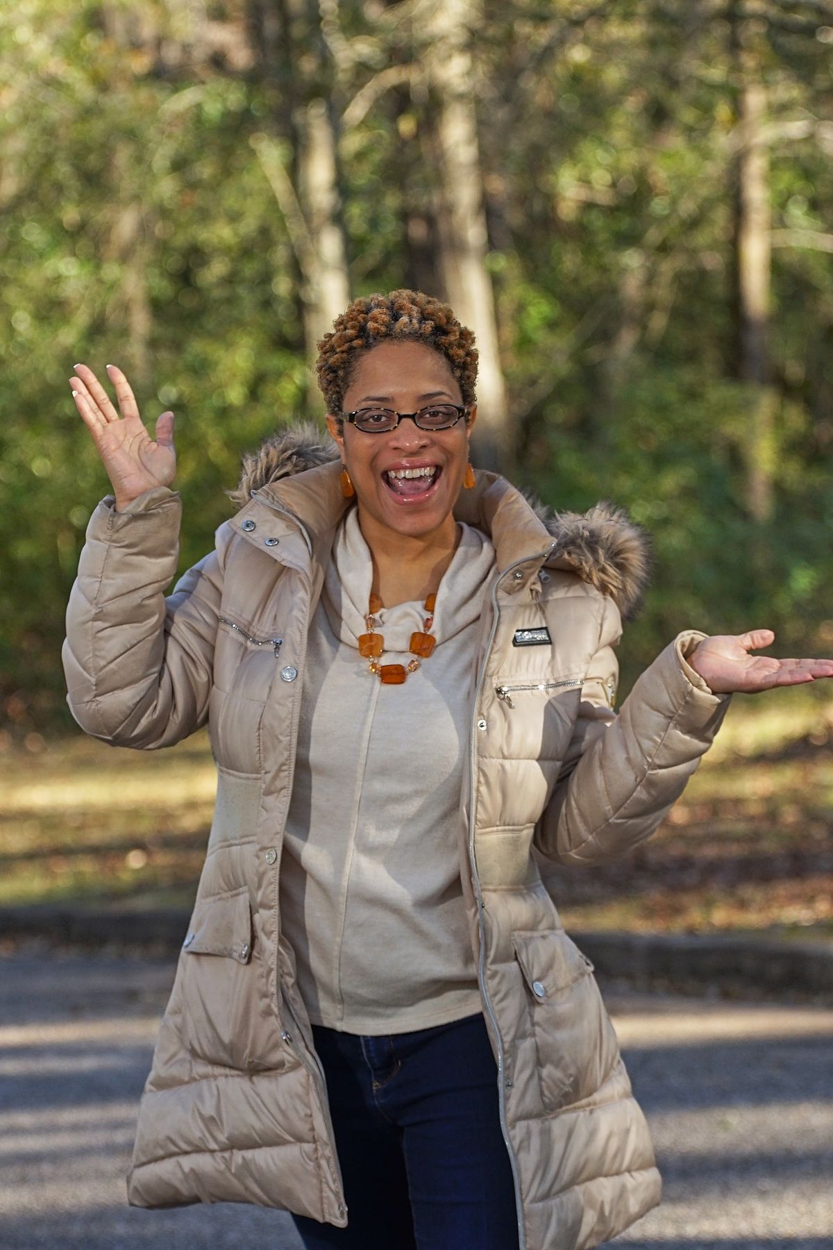 A joyful woman outdoors, representing Thrive's Money education area